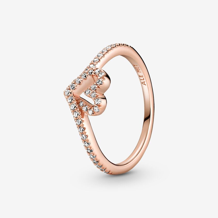 Sparkling Wishbone Heart Ring - Pandora West Africa Rings Gift the one you love the Sparkling Wishbone Heart Ring. Hand-finished in 14k rose gold plating, this piece is inspired by the iconic wishbone shape. The collection’s V-shape has been incorporated into the heart detail to create a fluid design. Clear cubic zirconia decorate the heart and top of the ring band. Present this style to someone special to show how much you care. (189302C01-56)  