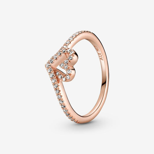 Sparkling Wishbone Heart Ring - Pandora West Africa Rings Gift the one you love the Sparkling Wishbone Heart Ring. Hand-finished in 14k rose gold plating, this piece is inspired by the iconic wishbone shape. The collection’s V-shape has been incorporated into the heart detail to create a fluid design. Clear cubic zirconia decorate the heart and top of the ring band. Present this style to someone special to show how much you care. (189302C01-56)  