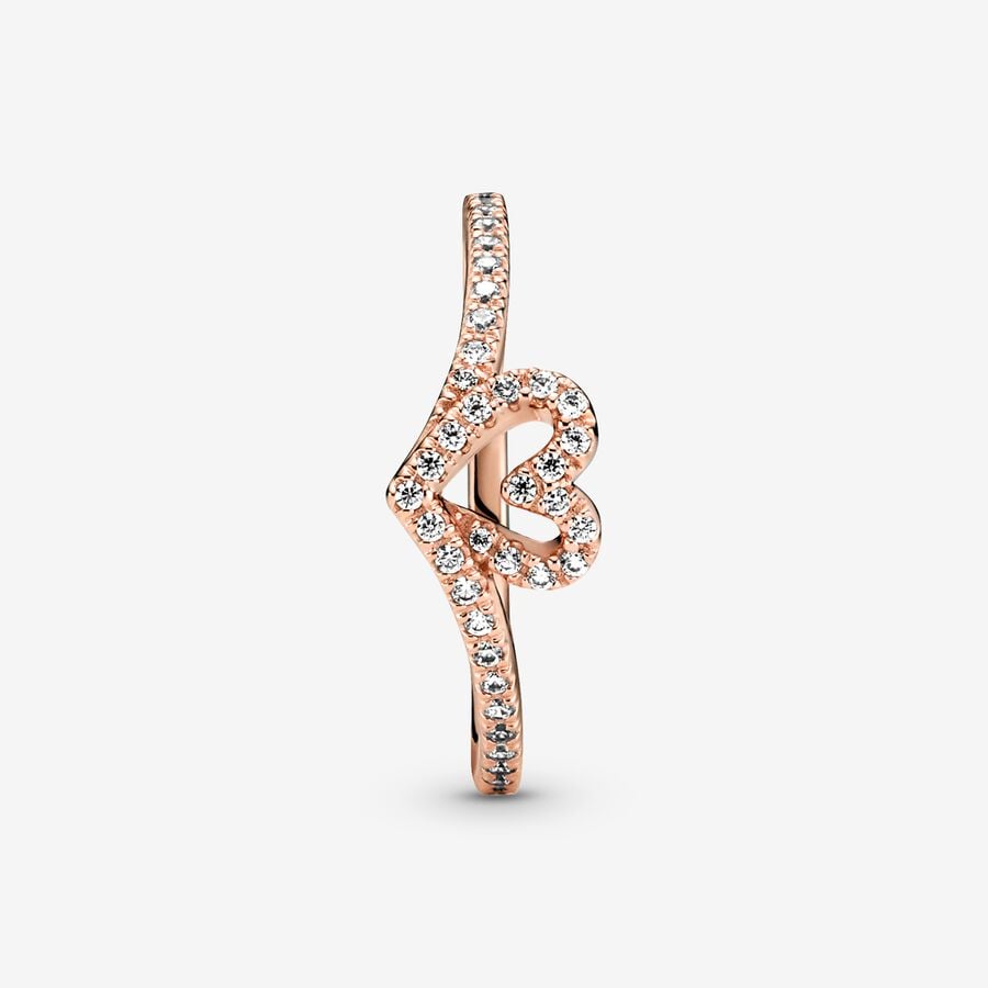 Sparkling Wishbone Heart Ring - Pandora West Africa Rings Gift the one you love the Sparkling Wishbone Heart Ring. Hand-finished in 14k rose gold plating, this piece is inspired by the iconic wishbone shape. The collection’s V-shape has been incorporated into the heart detail to create a fluid design. Clear cubic zirconia decorate the heart and top of the ring band. Present this style to someone special to show how much you care. (189302C01-56)  