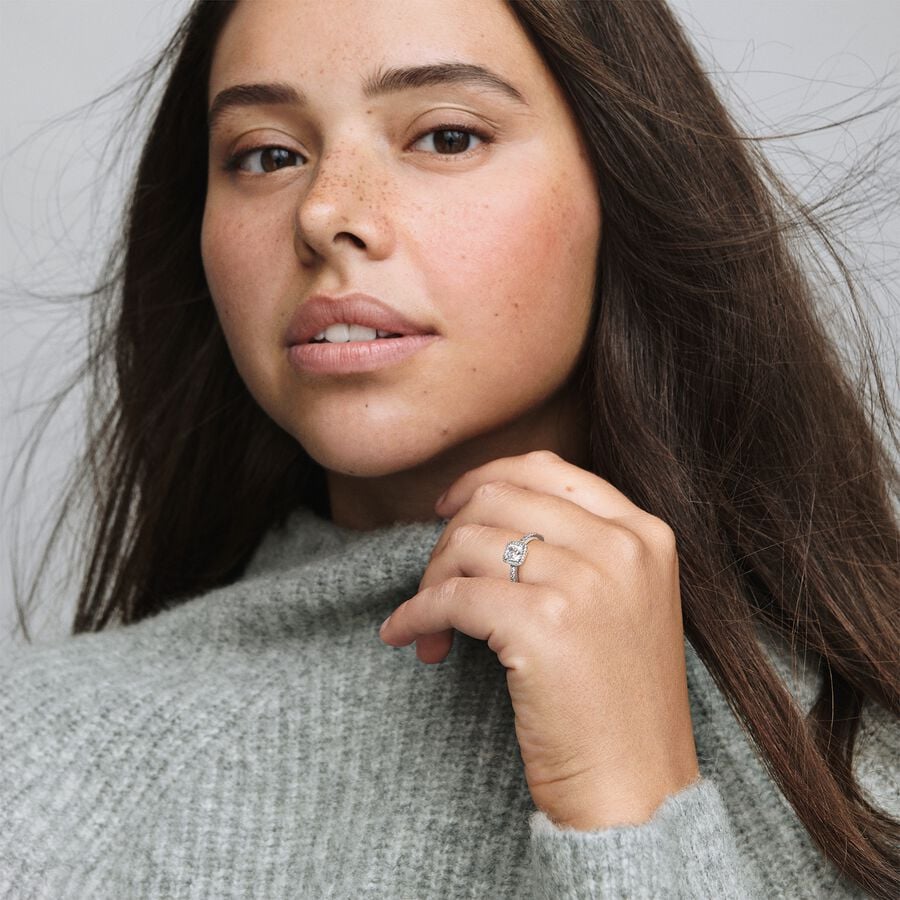 Square Sparkle Halo Ring - Pandora West Africa Jewelry This stunning vintage-inspired ring is one you'll treasure forever. Crafted in sterling silver, this sophisticated style is embellished with sparkling cubic zirconia stones and features a large, square-cut stone as the centerpiece. Wear it on its own as a statement cocktail ring, or style it with contrasting Pandora rings for a fresh, contemporary look. (198863C01)  