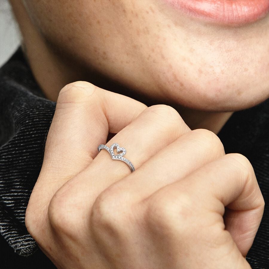 Sparkling Wishbone Heart Ring - Pandora West Africa Rings Gift the one you love the Sparkling Wishbone Heart Ring. Hand-finished in sterling silver, this piece is inspired by classic Pandora design elements. The heart detail has been incorporated into the series' iconic V-shape to create a heartfelt design. Clear cubic zirconia decorate the heart and top of the ring shank. Present this style to someone special to show how much you care. (199302C01-54)  