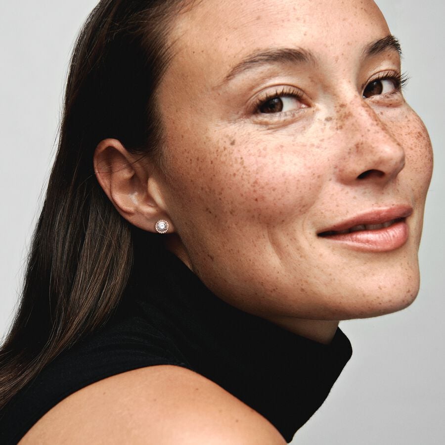 Round Sparkle Halo Stud Earrings - Pandora West Africa Earrings When you want classic elegance and a dose of drama, reach for these Round Sparkle Halo Stud Earrings. With a distinctly vintage feel, the 14k rose gold-plated, hand-finished pieces are centred with a brilliant cubic zirconia that is surrounded by a halo of smaller stones. The earrings work with everything, day or night. Try styling them with the corresponding pendant necklace, inspired by antique jewellery box treasures. (286272CZ)  