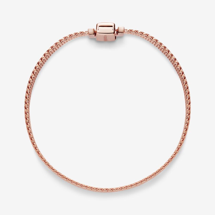 Pandora Reflexions™ Mesh Bracelet - Pandora West Africa Bracelets Pandora Reflexions is a modern way to reflect who you are. The Reflexions Mesh Bracelet holds clip-on charms that sit flush to mirror your style – whatever shape it takes. Plated with 14k rose gold for a blush-pink finish, this piece looks equally cool worn alone or stacked with other bracelets. Weave your story into your style and go gold and bold, adding your favourite charms from the collection. (587712-20)  
