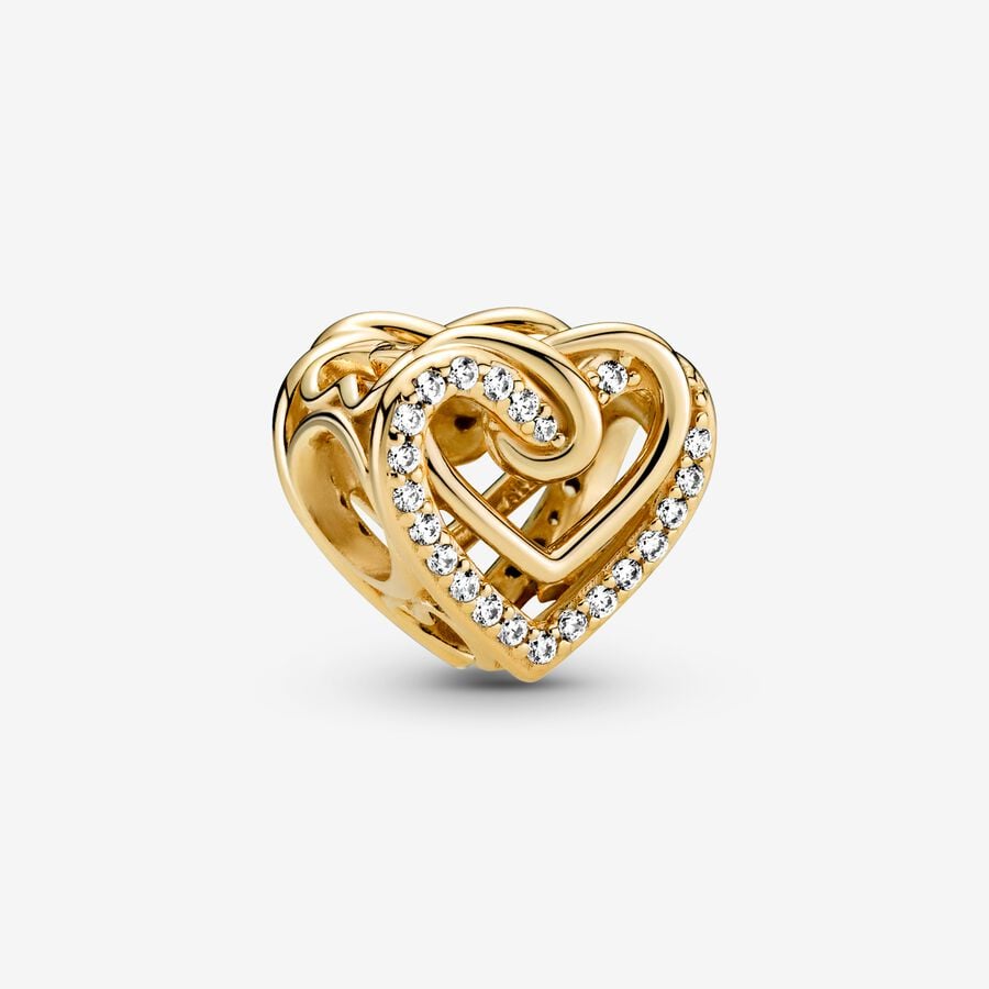 Sparkling Entwined Hearts Charm - Pandora West Africa Charms This Sparkling Entwined Hearts Charm is the perfect gift for someone with a heart of gold. Hand-finished, this design includes intertwining polished 14k gold-plated hearts and sparkling stone-embellished hearts on the front and back. Entwined hearts also feature on the sides. Inspired by eternal love, present this detailed openwork charm to someone special. (769270C01)  