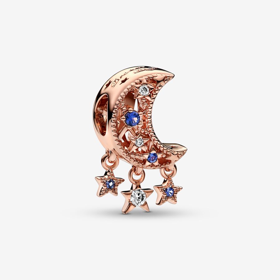 Star & Crescent Moon Charm - Pandora West Africa Charms Add celestial sparkle to any look with the Star & Crescent Moon Charm. Finished in 14k rose gold plating, the charm has been carefully detailed by hand with rows of cubic zirconia and cut-out star and circle shapes. Microbeads decorate the edges and asymmetric stars with stones and microbeads dangle from the sides. The cosmic charm is engraved with the message "Dream big" to remind you to always reach for the stars. (789643C01)  