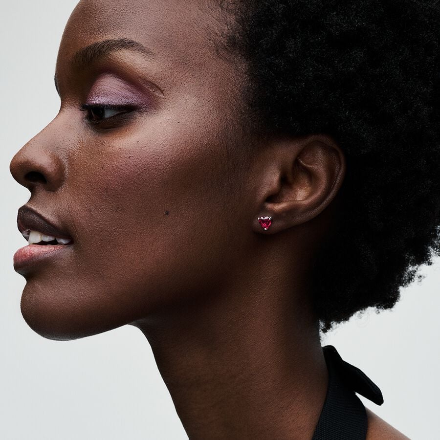 Red Heart Stud Earrings - Pandora West Africa Earrings Turn up the romance with our Red Heart Stud Earrings. Heart-shaped faceted red man-made crystals sparkle in a sterling silver three-prong setting. Make a bold declaration of love and pair this set with other heart pieces. 292549C01  